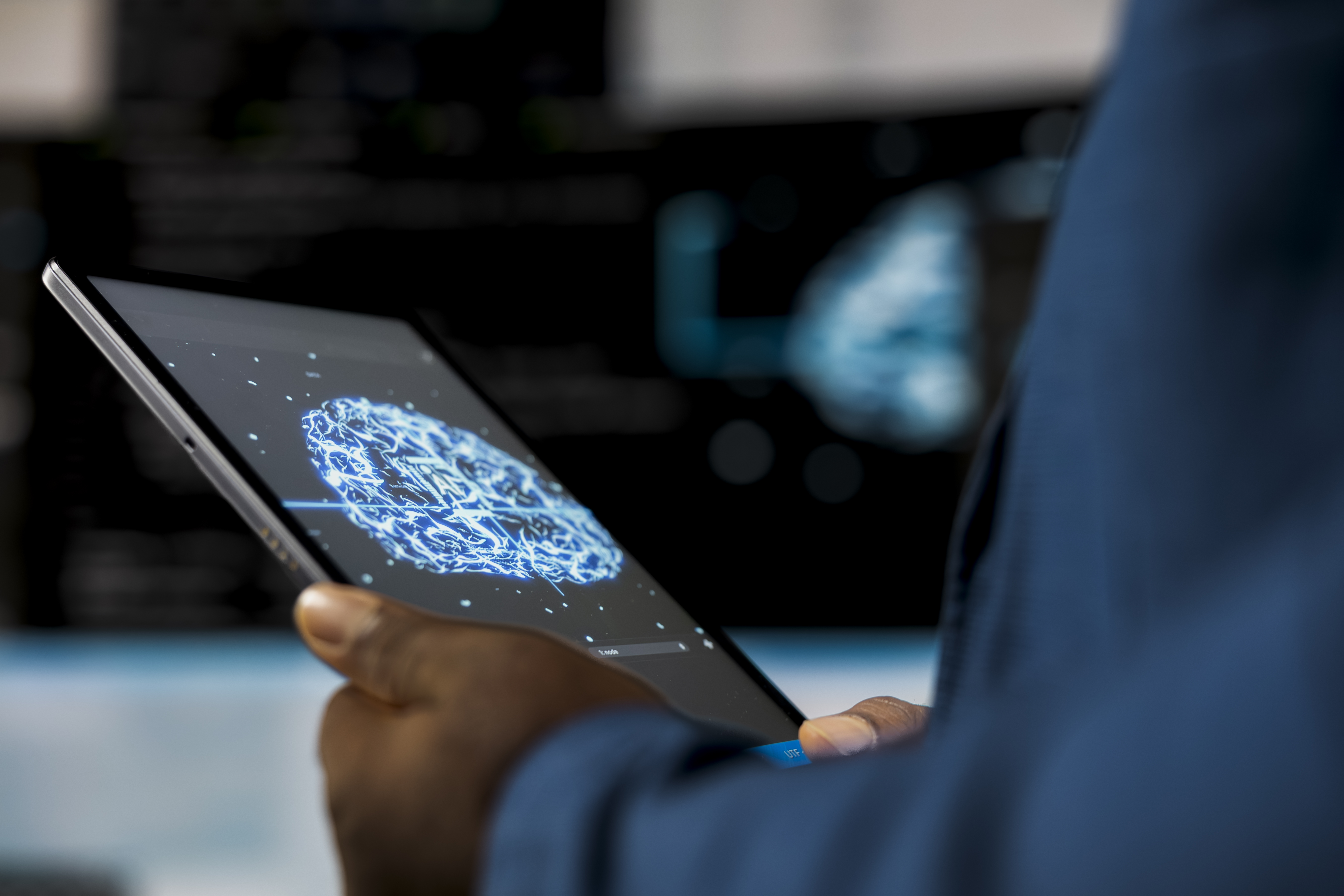 Laptop screen showing code editor and terminal with AI neural network graphics, representing AI technology trends and development in 2025